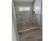 Bathroom showcasing a large tiled shower with marble accents and a window at 3076 Zodiac Ct, Lawrenceville, GA 30044