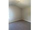 Carpeted bedroom with natural light, neutral walls, and high ceilings at 3076 Zodiac Ct, Lawrenceville, GA 30044