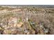 Expansive aerial view of a wooded neighborhood showcasing the surrounding landscape and home sites at 4411 Windsor Oaks Cir, Marietta, GA 30066