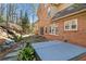 Brick house exterior highlighting the back patio and hot tub at 4411 Windsor Oaks Cir, Marietta, GA 30066