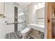 Modern bathroom with a sleek vanity, stylish black-and-white tile accents, and a glass-enclosed shower at 4411 Windsor Oaks Cir, Marietta, GA 30066