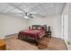 Comfortable bedroom with hardwood floors and a decorative ceiling at 4411 Windsor Oaks Cir, Marietta, GA 30066