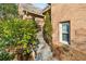 Stone steps lead up to the home, framed by lush greenery and a classic brick exterior at 4411 Windsor Oaks Cir, Marietta, GA 30066