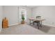 Functional home office with a rustic wooden desk, a cozy chair, and natural light from the window at 4411 Windsor Oaks Cir, Marietta, GA 30066