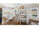 Bright kitchen with white cabinets, large island, and adjacent dining space at 4411 Windsor Oaks Cir, Marietta, GA 30066