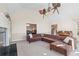 Bright living room featuring a fireplace, hardwood floors, and comfortable sectional sofa at 4411 Windsor Oaks Cir, Marietta, GA 30066