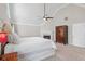 Inviting main bedroom featuring a fireplace, vaulted ceiling, and decorative cabinet at 4411 Windsor Oaks Cir, Marietta, GA 30066
