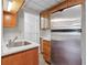 Well-organized pantry featuring ample shelving, a stainless steel refrigerator, and sleek countertops for storage at 4411 Windsor Oaks Cir, Marietta, GA 30066