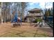 Playground featuring a playset, seating, and a covered pavilion for outdoor activities and relaxation at 4411 Windsor Oaks Cir, Marietta, GA 30066