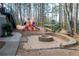 Community playground featuring a vibrant playset and cozy fire pit area for outdoor enjoyment at 4411 Windsor Oaks Cir, Marietta, GA 30066