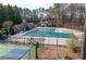 Community pool, tennis court, and pool house offering various recreational activities at 4411 Windsor Oaks Cir, Marietta, GA 30066