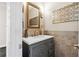 Stylish powder room with a decorative vanity, elegant mirror, and modern lighting at 4411 Windsor Oaks Cir, Marietta, GA 30066