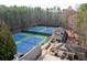 Aerial view of community tennis courts, pavilion, and playground for leisure and recreation at 4411 Windsor Oaks Cir, Marietta, GA 30066