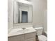 This bathroom features a white vanity sink and a mirror, plus a white toilet at 622 Providence Sw Pl, Atlanta, GA 30331