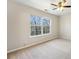 A bright bedroom with a large window overlooking the yard at 622 Providence Sw Pl, Atlanta, GA 30331