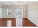 Dining area features hardwood floors, large windows, and access to the deck at 622 Providence Sw Pl, Atlanta, GA 30331