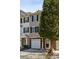 Two-story townhome with brick facade, garage, and well-maintained landscaping, showcasing its curb appeal at 622 Providence Sw Pl, Atlanta, GA 30331