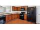 A functional kitchen with wooden cabinets and modern appliances at 622 Providence Sw Pl, Atlanta, GA 30331