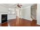 Open living room with hardwood floors, fireplace, and staircase at 622 Providence Sw Pl, Atlanta, GA 30331