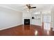 A spacious living room with a cozy fireplace and gleaming hardwood floors at 622 Providence Sw Pl, Atlanta, GA 30331