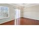 Living room with hardwood floors, window with blinds and sliding glass door at 622 Providence Sw Pl, Atlanta, GA 30331