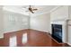 Bright living room with hardwood floors, fireplace, and large windows at 622 Providence Sw Pl, Atlanta, GA 30331
