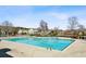 Community pool with large sundeck and view of the surrounding neighborhood at 622 Providence Sw Pl, Atlanta, GA 30331