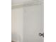 This walk-in closet features a single shelving unit with metal rack for storage at 622 Providence Sw Pl, Atlanta, GA 30331