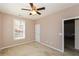 Comfortable bedroom with neutral walls, carpet, and ample natural light from the window at 1130 Camry Cir, Dallas, GA 30157