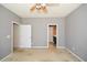 Bedroom showcasing neutral walls and view of a nearby bathroom, perfect for a home office at 1130 Camry Cir, Dallas, GA 30157