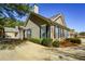 Well-maintained exterior with brick accents, lush landscaping, and a long private driveway at 1130 Camry Cir, Dallas, GA 30157