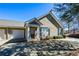 Attractive home exterior with a well-manicured lawn, tidy landscaping, and a private driveway at 1130 Camry Cir, Dallas, GA 30157