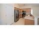 Modern kitchen with stainless steel refrigerator, light cabinets, and tile flooring at 1130 Camry Cir, Dallas, GA 30157