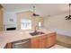 Bright kitchen features stainless steel appliances, sink and faucet, and cream countertops at 1130 Camry Cir, Dallas, GA 30157