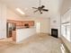 Open-concept living room with stainless steel appliances, breakfast bar and gas fireplace at 1130 Camry Cir, Dallas, GA 30157