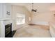 Spacious living room featuring a fireplace, large window, and entry to the exterior at 1130 Camry Cir, Dallas, GA 30157