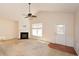 Cozy living room features a fireplace and access to the exterior via a glass-paneled door at 1130 Camry Cir, Dallas, GA 30157