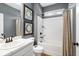 Well-lit bathroom with a combination shower and tub, a modern vanity, and stylish fixtures at 145 Silver Leaf Trce, Douglasville, GA 30134
