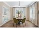 Cozy dining area with natural light, wooden table and stylish decor at 145 Silver Leaf Trce, Douglasville, GA 30134