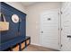 Organized mud room with a blue storage bench and woven baskets at 145 Silver Leaf Trce, Douglasville, GA 30134