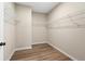 Spacious walk-in closet with white wire shelving and wood-look flooring at 145 Silver Leaf Trce, Douglasville, GA 30134