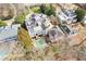 An aerial view showcases the expansive property with a pool, patio area, and lush surroundings at 3977 Sweet Bottom Dr, Duluth, GA 30096