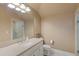 Neutral toned bathroom featuring a large vanity with a framed mirror and tiled shower at 3977 Sweet Bottom Dr, Duluth, GA 30096