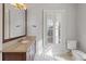 Light and airy bathroom with a light colored vanity, shuttered windows, and recessed lighting at 3977 Sweet Bottom Dr, Duluth, GA 30096