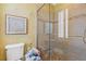 Elegant bathroom with tiled shower, mosaic floor, decorative art and textured walls at 3977 Sweet Bottom Dr, Duluth, GA 30096
