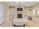 Luxurious bathroom featuring a freestanding tub, fireplace, and elegant chandelier at 3977 Sweet Bottom Dr, Duluth, GA 30096