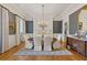 Elegant dining room featuring hardwood floors, a fireplace, and an ornate chandelier at 3977 Sweet Bottom Dr, Duluth, GA 30096