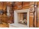 Close up of the wood paneled fireplace in the home office with lion ornamentation at 3977 Sweet Bottom Dr, Duluth, GA 30096