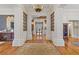 Stunning foyer showcases elegant columns, polished hardwood floors, and intricate details that add to the home's grandeur at 3977 Sweet Bottom Dr, Duluth, GA 30096