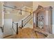 Grand foyer featuring tile flooring, staircase, and a vintage cabinet at 3977 Sweet Bottom Dr, Duluth, GA 30096